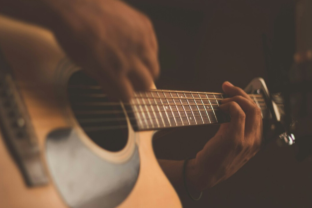 musician playing guitar